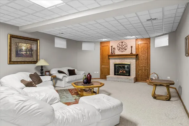 a bedroom with furniture and a fireplace