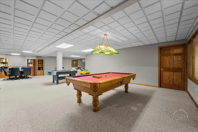 a room with furniture and gym equipment