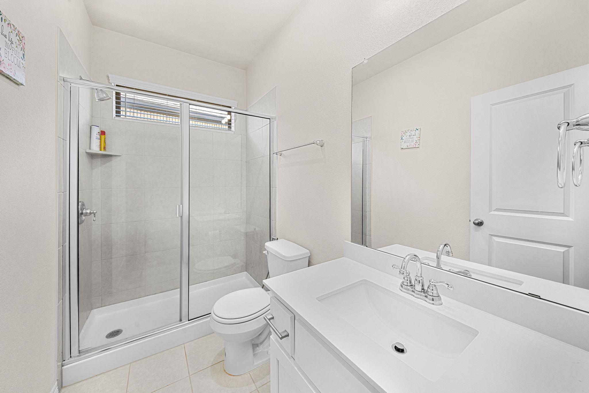 20813 Carries Ranch Road Pflugerville, TX 78660 - Photo 6 of 40 Clean lines and a spacious glass shower define this modern bathroom.