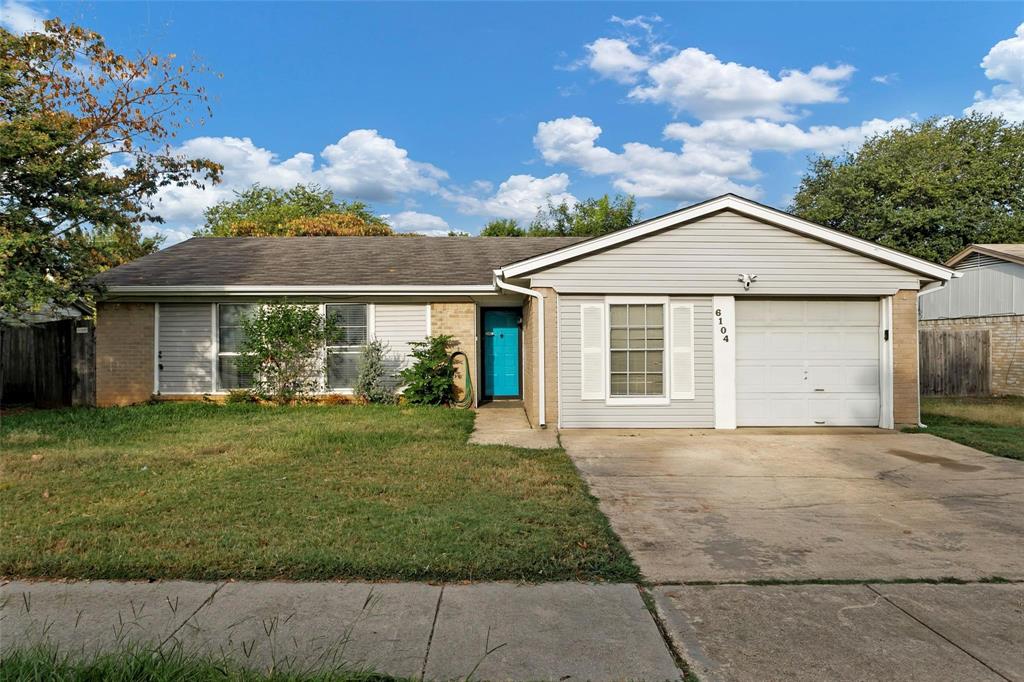 6104 Kelly Elliott Road Arlington, TX 76001 - Photo 1 of 25 a front view of a house with a garden