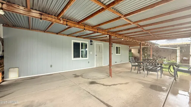 a view of a porch with furniture