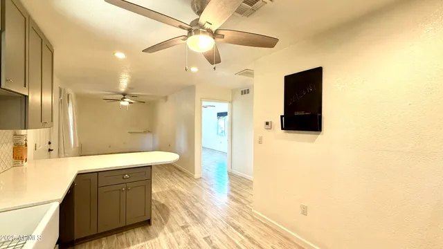 a bathroom with a bathtub shower sink and a mirror