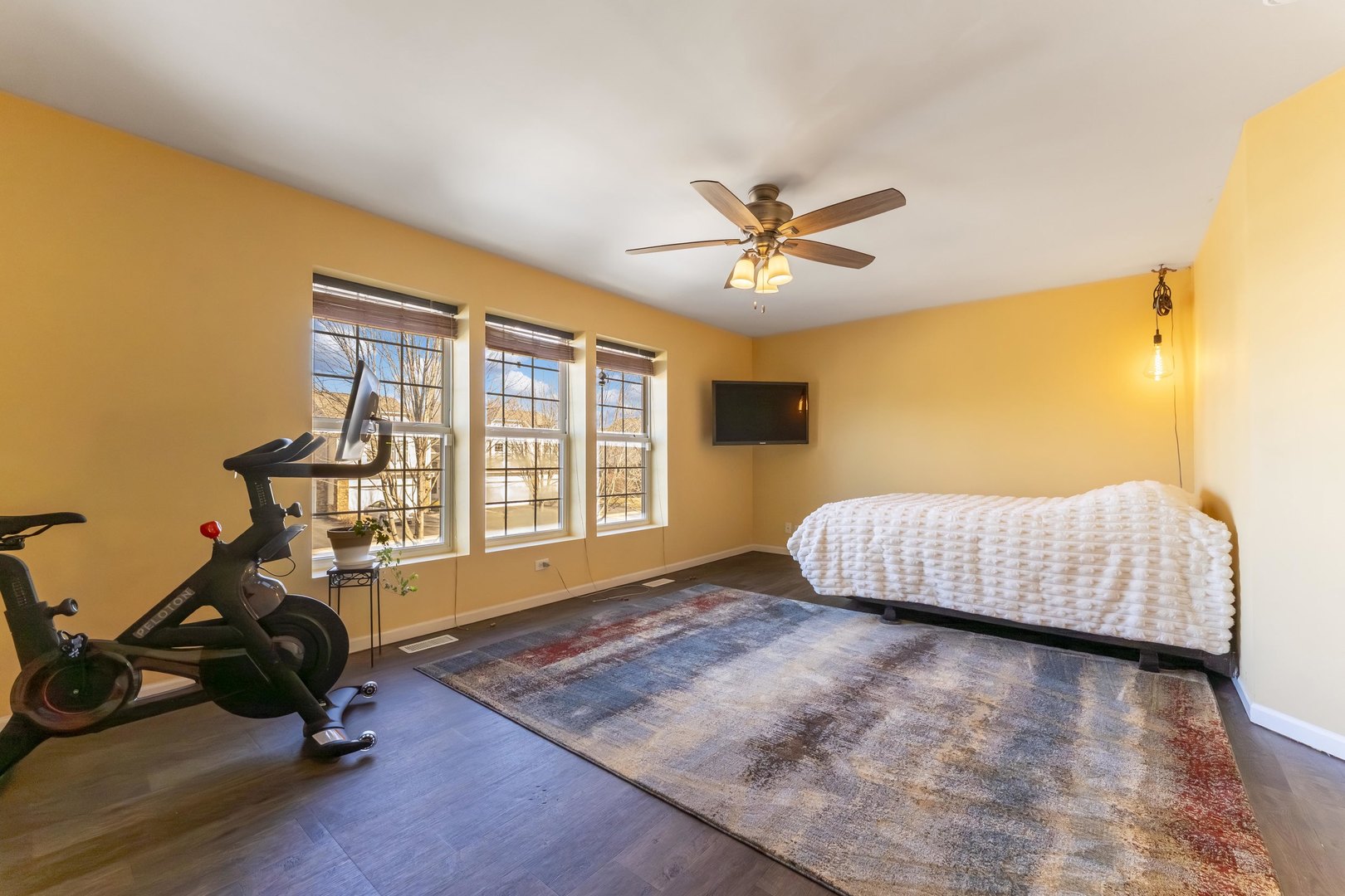 794 Pointe Drive, Unit 794 Crystal Lake, IL 60014 - Photo 12 of 20 a bedroom with a bed and wooden floor
