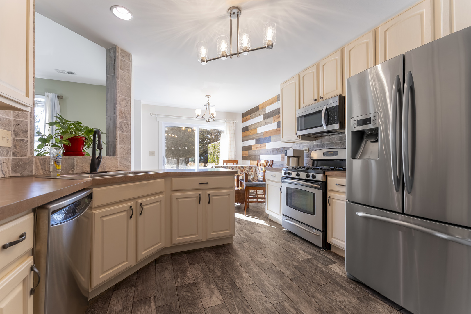794 Pointe Drive, Unit 794 Crystal Lake, IL 60014 - Photo 6 of 20 a kitchen with stainless steel appliances a refrigerator sink and microwave