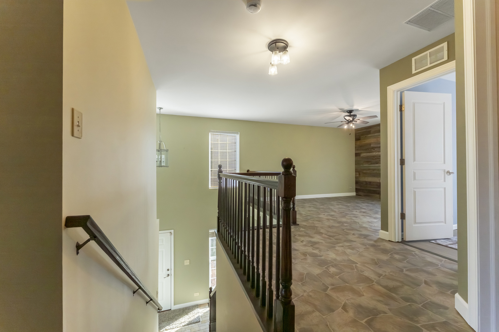 794 Pointe Drive, Unit 794 Crystal Lake, IL 60014 - Photo 9 of 20 a view of hallway with stairs