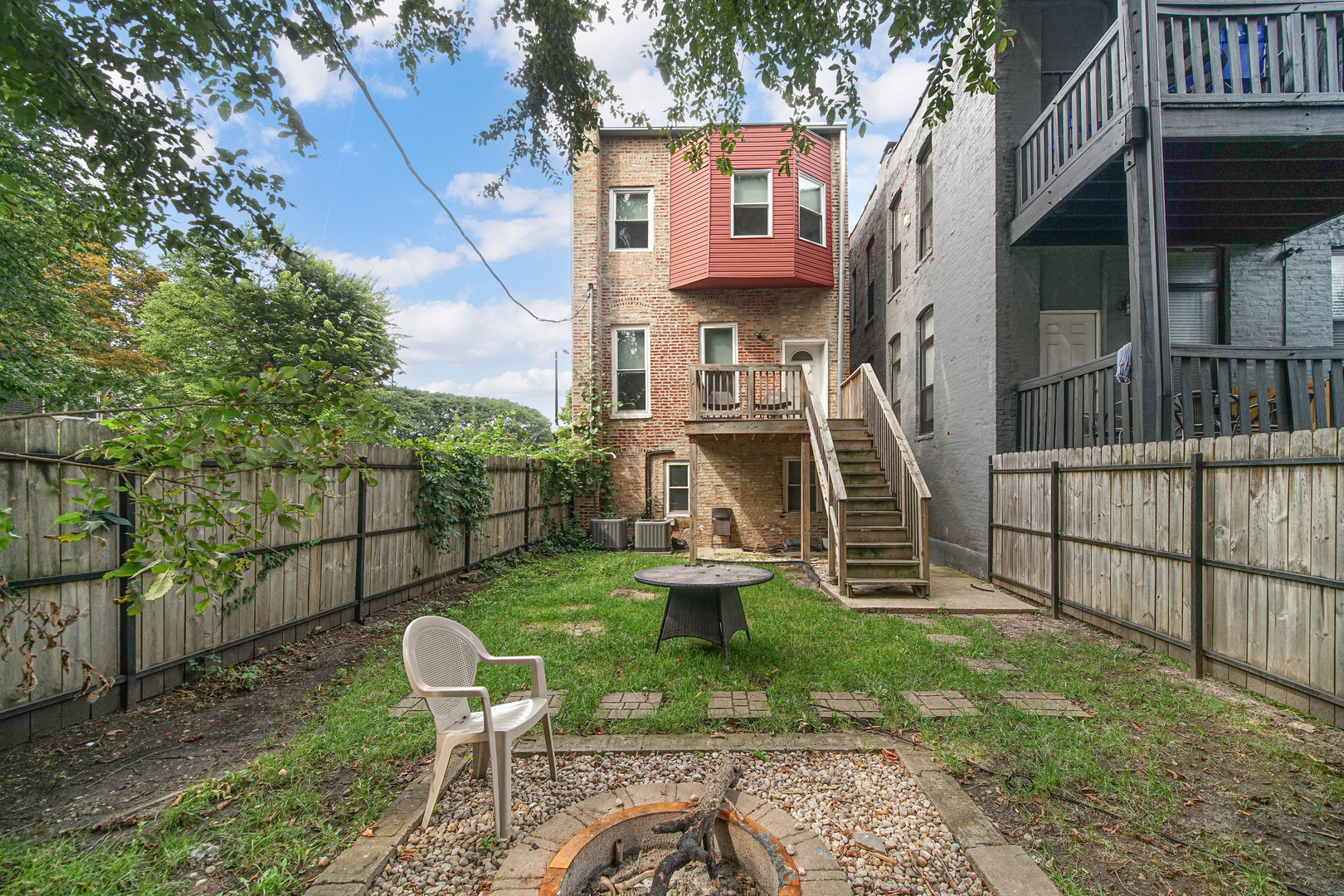 2123 West Adams Street Chicago, IL 60612 - Photo 27 of 29 a view of a chair and table in backyard of the house