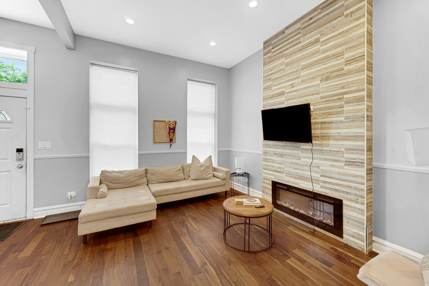 2123 West Adams Street Chicago, IL 60612 - Photo 3 of 29 a living room with fireplace furniture and a flat screen tv