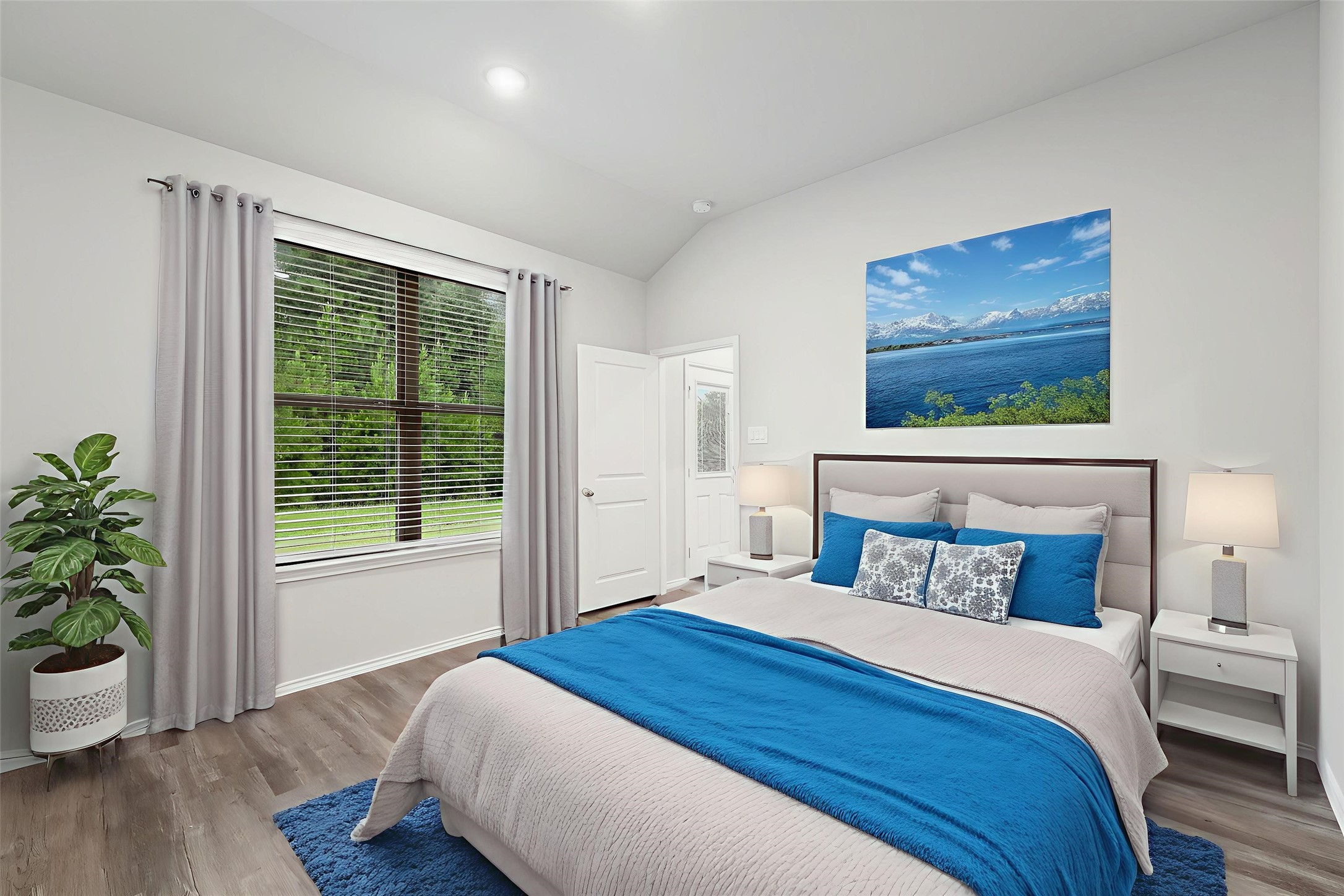 369 Byrd Drive Lufkin, TX 75901 - Photo 13 of 29 a bedroom with a large bed and a potted plant