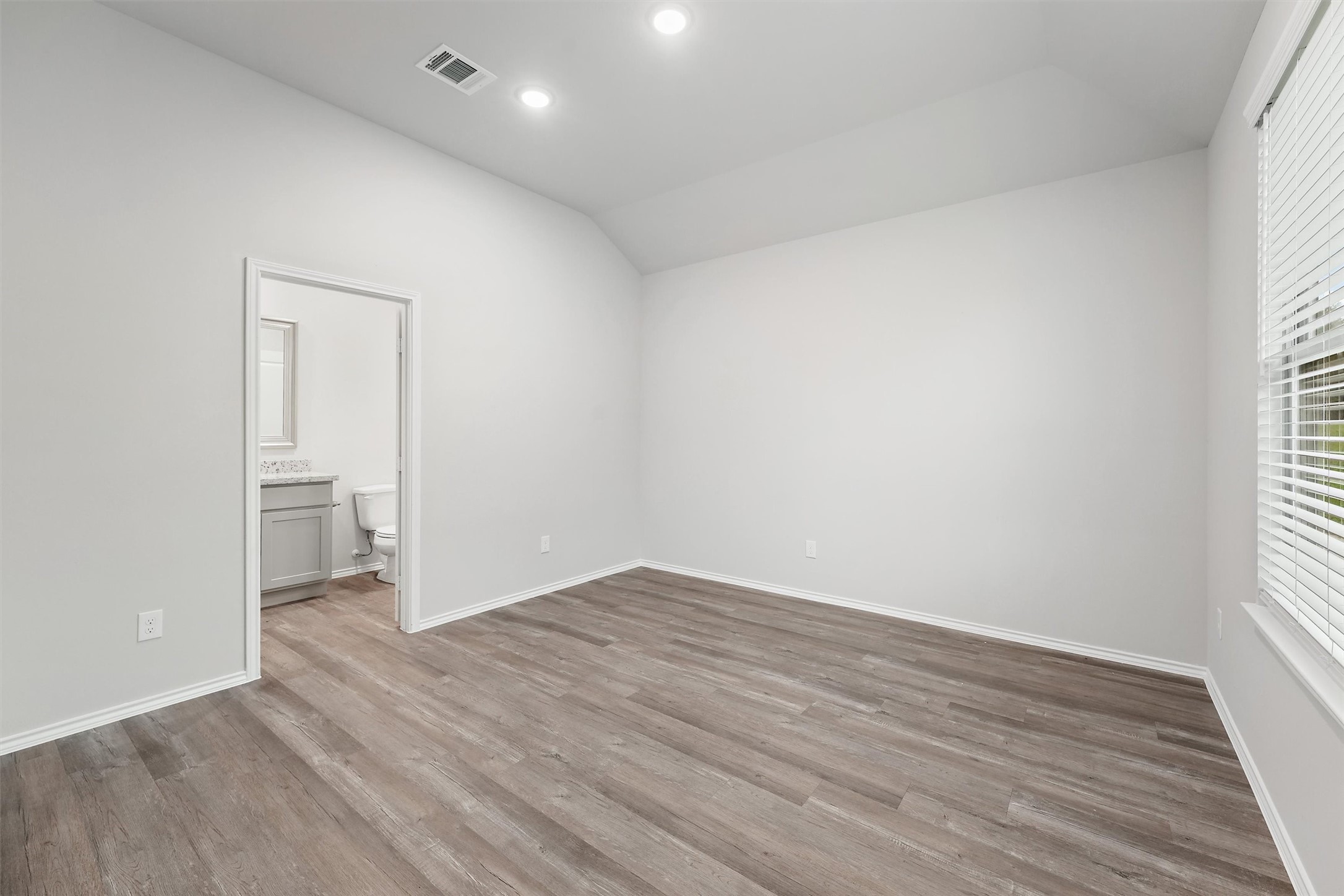 369 Byrd Drive Lufkin, TX 75901 - Photo 14 of 29 a view of an empty room with wooden floor and a window