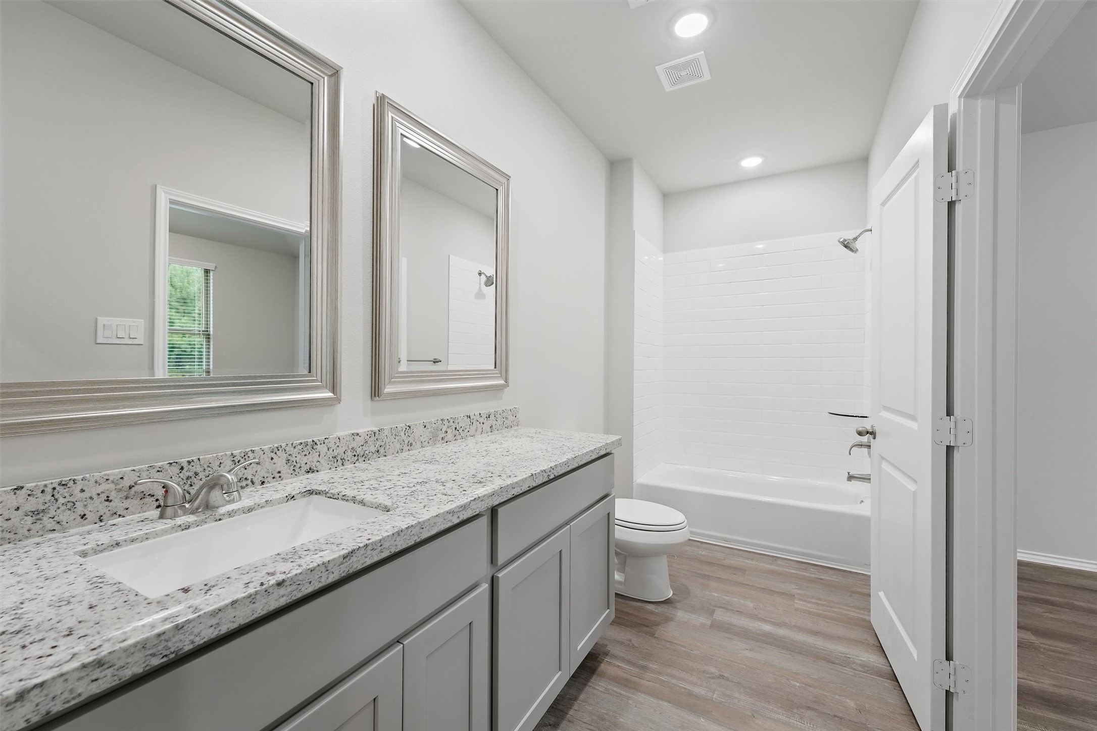 369 Byrd Drive Lufkin, TX 75901 - Photo 17 of 29 a bathroom with a granite countertop sink a toilet and shower