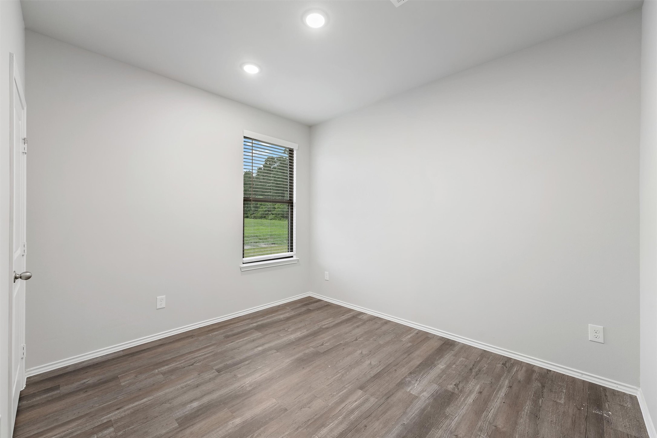 369 Byrd Drive Lufkin, TX 75901 - Photo 20 of 29 a view of an empty room with wooden floor and a window