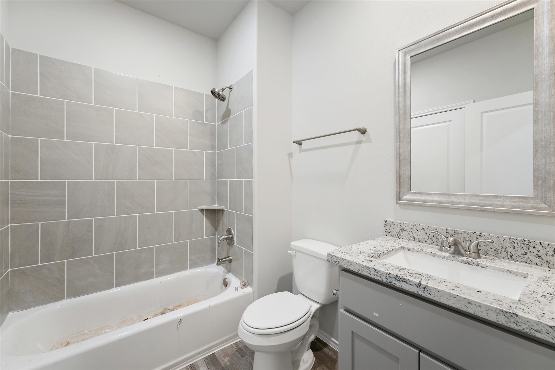 369 Byrd Drive Lufkin, TX 75901 - Photo 23 of 29 a bathroom with a granite countertop sink a toilet and bathtub