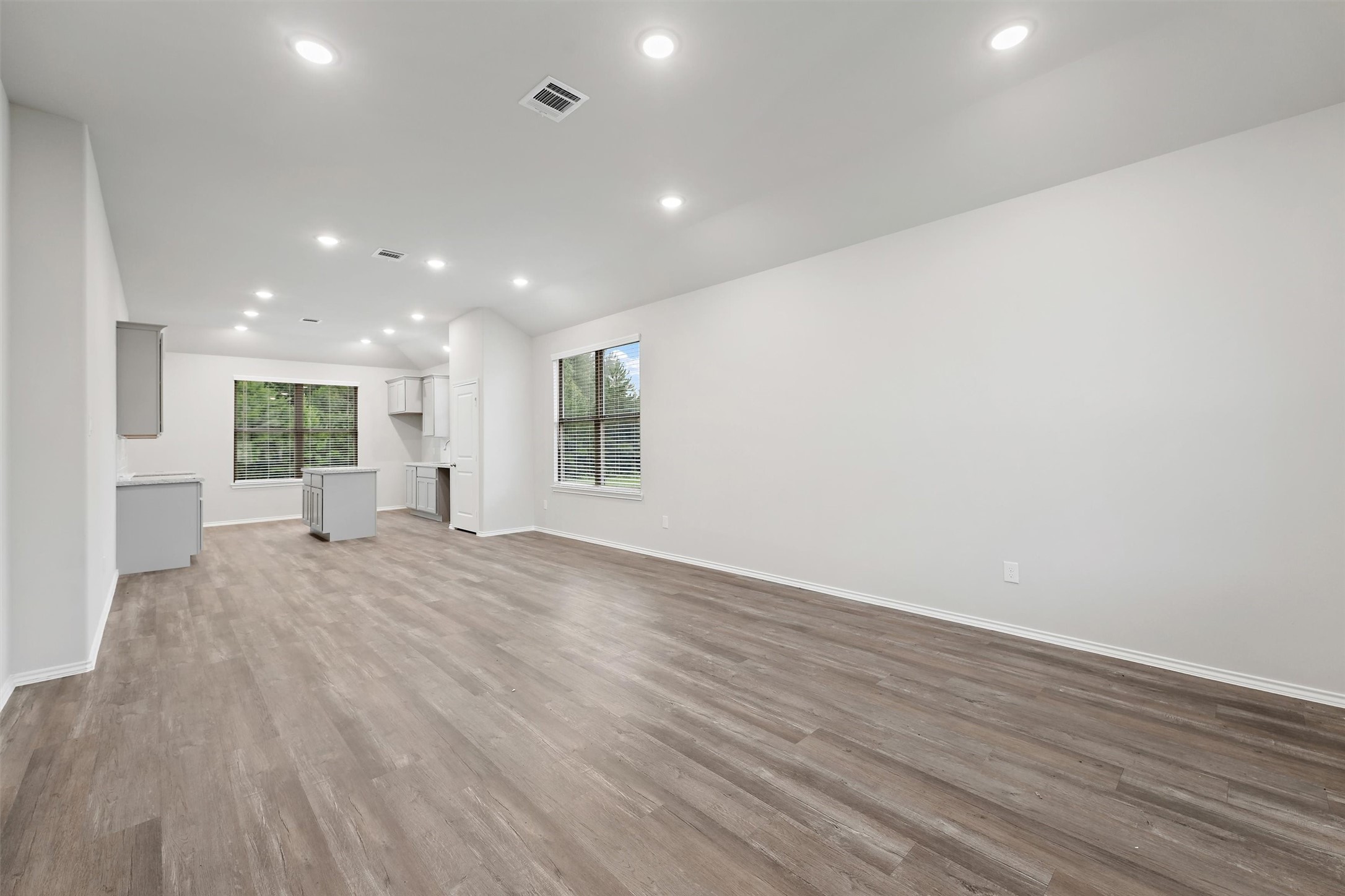 369 Byrd Drive Lufkin, TX 75901 - Photo 3 of 29 a view of an empty room with wooden floor and a window