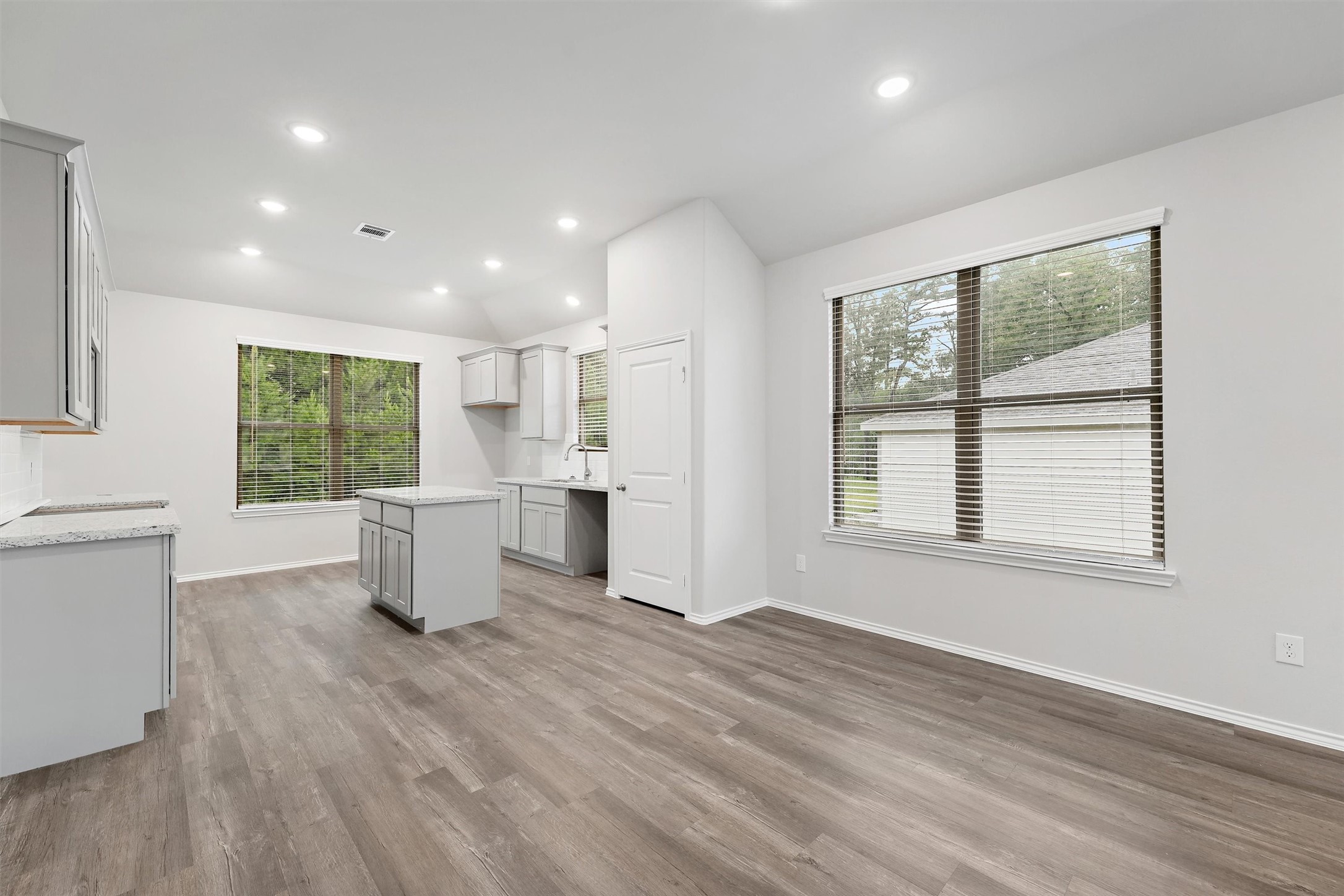 369 Byrd Drive Lufkin, TX 75901 - Photo 5 of 29 a view of an empty room with wooden floor and a window