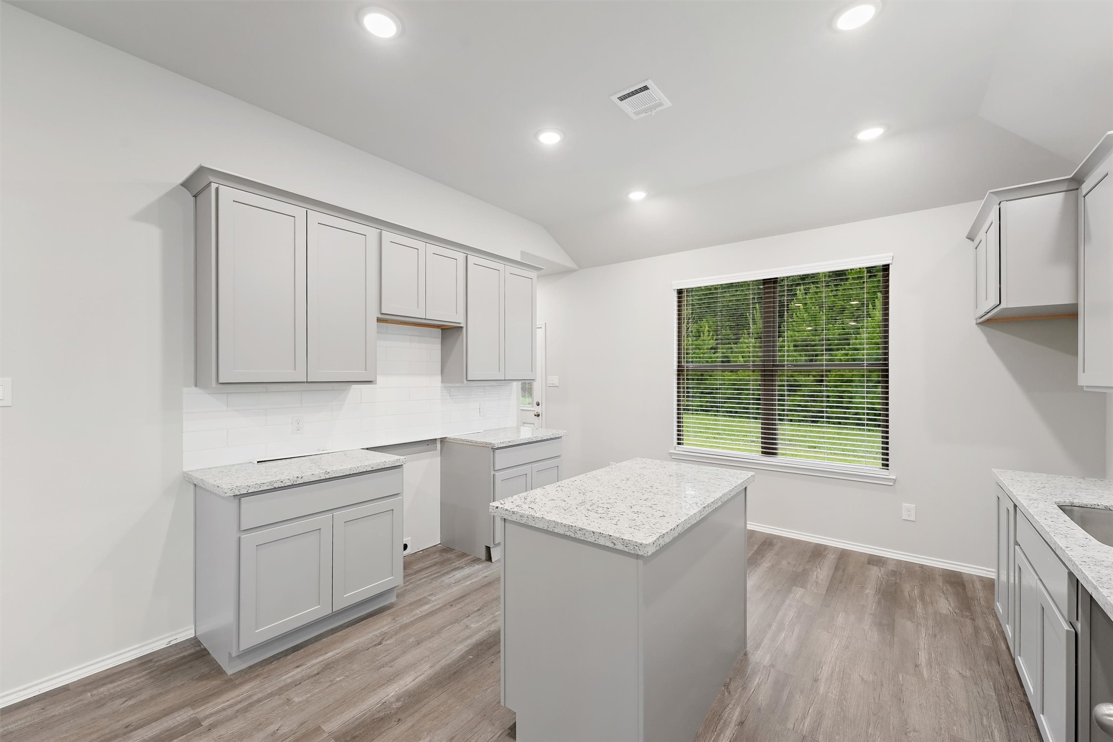 369 Byrd Drive Lufkin, TX 75901 - Photo 9 of 29 a view of a kitchen with a sink dishwasher and wooden floor