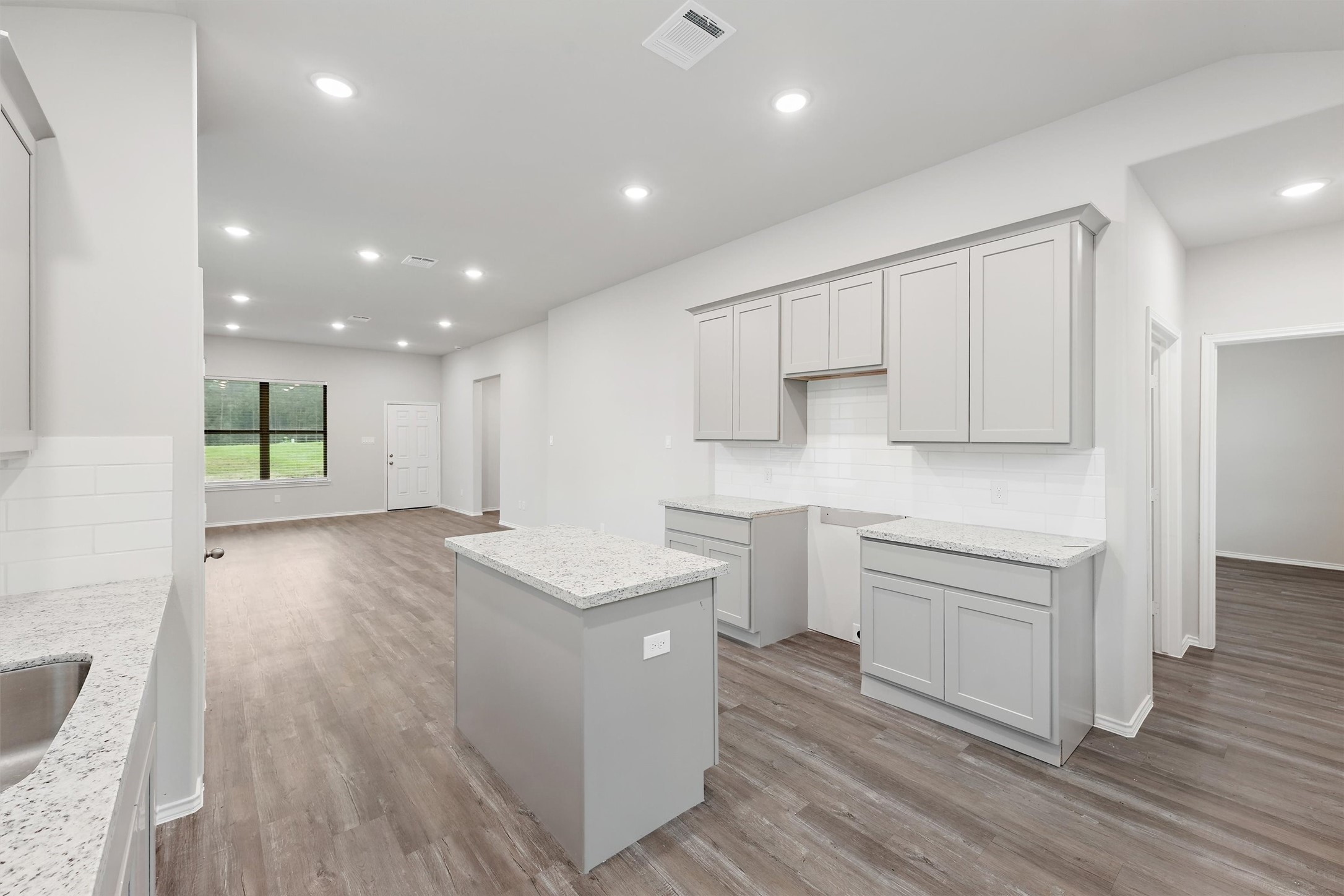 369 Byrd Drive Lufkin, TX 75901 - Photo 10 of 29 a kitchen with white cabinets and sink