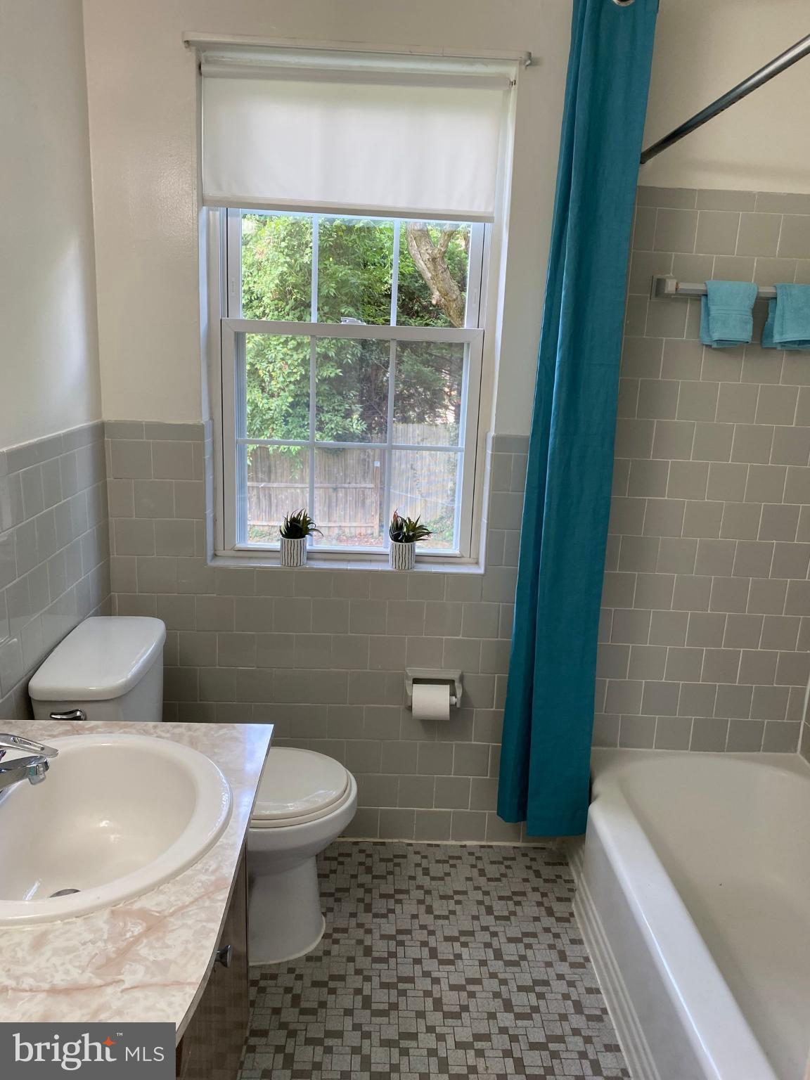 312 East Melrose Avenue Baltimore, MD 21212 - Photo 2 of 6 a white toilet sitting next to a bath tub