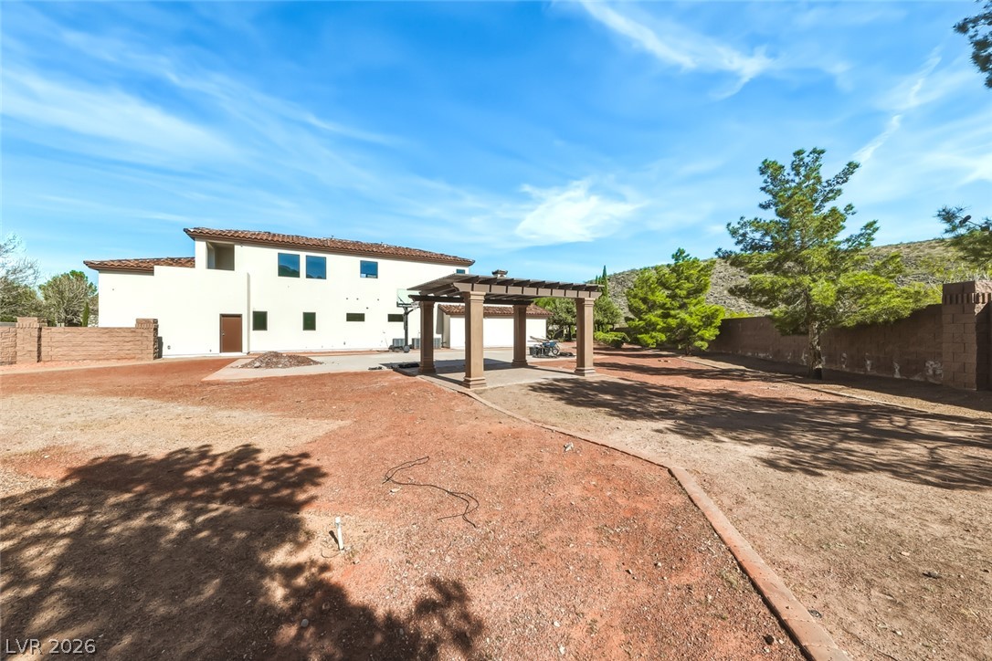 1140 Julie Road Henderson, NV 89002 - Photo 12 of 38 The land goes on and on! Sport court and an inviting outdoor pergola.