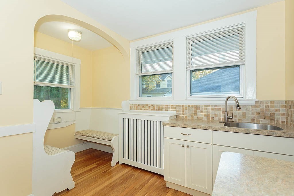 15 Fairfax Road Milton, MA 02186 - Photo 17 of 37 a bathroom with a granite countertop sink mirror vanity and toilet