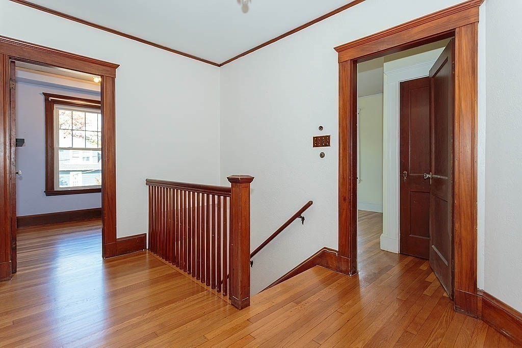 15 Fairfax Road Milton, MA 02186 - Photo 20 of 37 a view of a hallway with wooden floor and stairs
