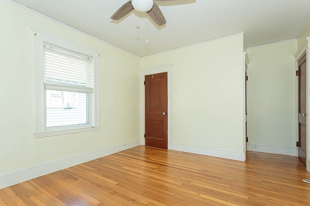 15 Fairfax Road Milton, MA 02186 - Photo 22 of 37 a view of an empty room with wooden floor and a window