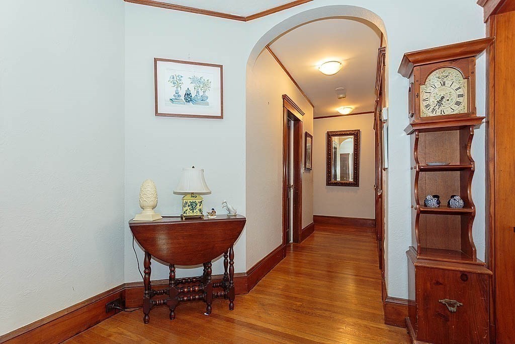15 Fairfax Road Milton, MA 02186 - Photo 32 of 37 a view of a hallway with wooden floor and a workspace