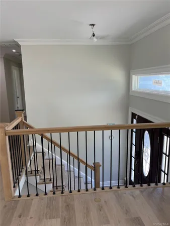 a view of staircase with rug