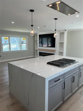 a kitchen with stove and cabinets