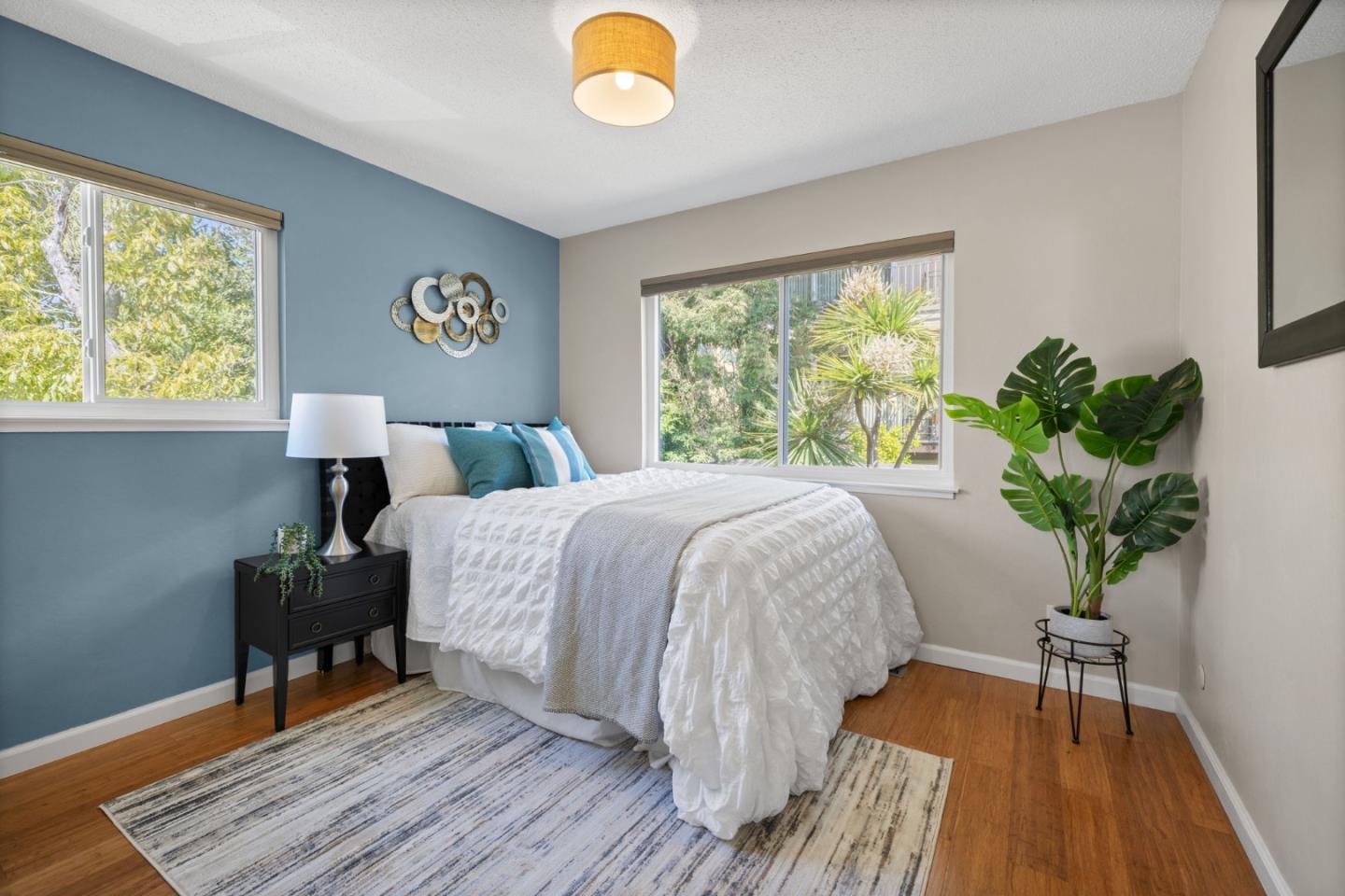 1337 Henry Street, Unit E Berkeley, CA 94709 - Photo 15 of 33 a bed sitting in a bedroom next to a window