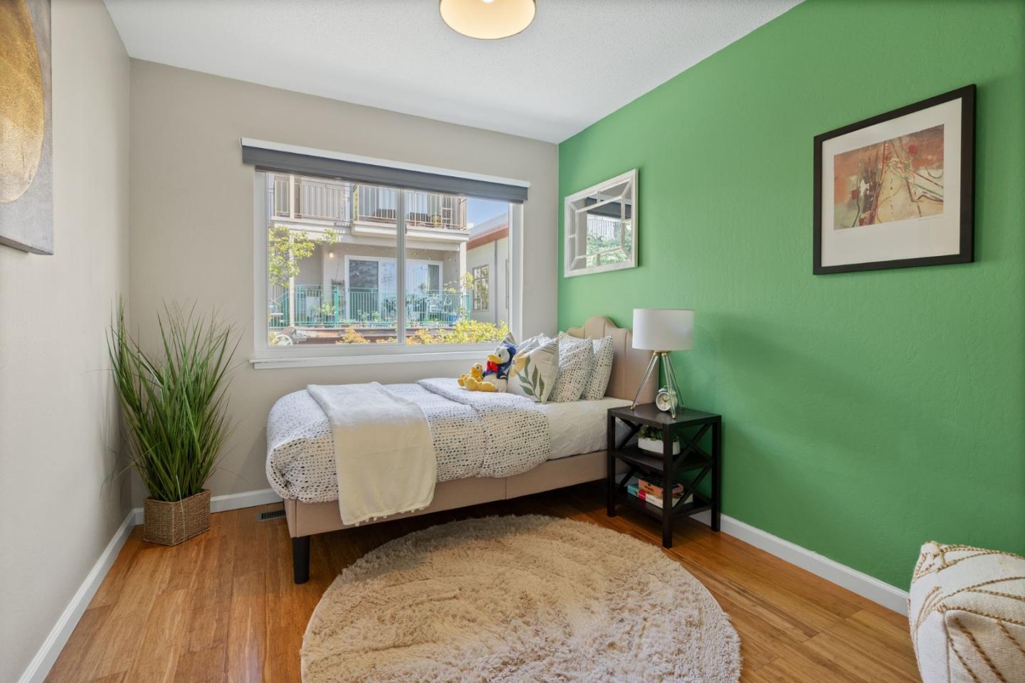 1337 Henry Street, Unit E Berkeley, CA 94709 - Photo 17 of 33 a bedroom with a bed and a window