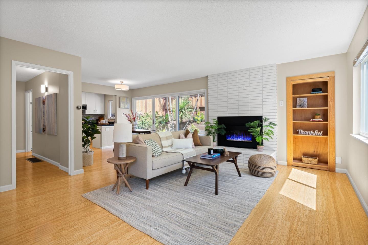 1337 Henry Street, Unit E Berkeley, CA 94709 - Photo 2 of 33 a living room with furniture and a fireplace