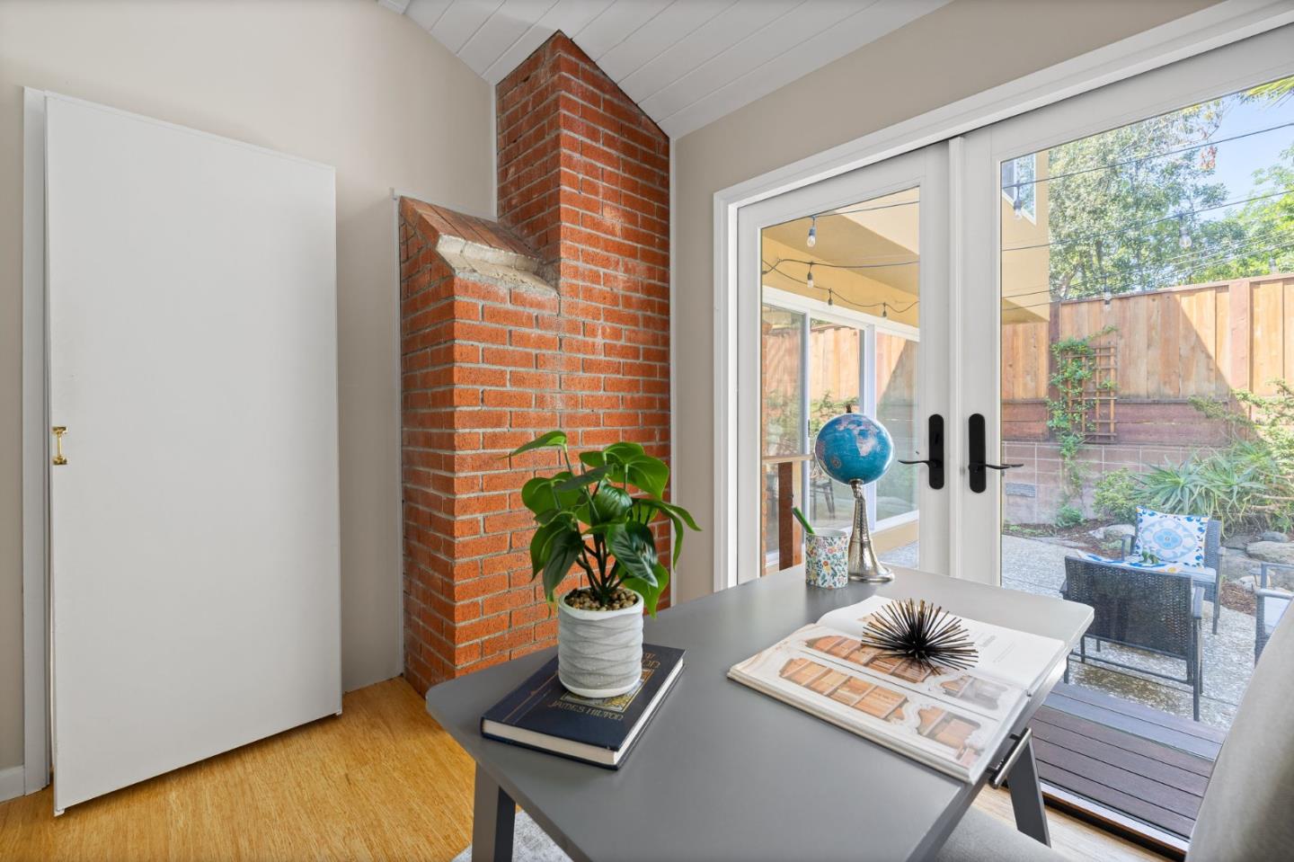 1337 Henry Street, Unit E Berkeley, CA 94709 - Photo 22 of 33 a living room with furniture and a potted plant