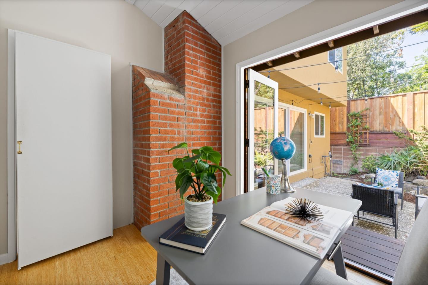1337 Henry Street, Unit E Berkeley, CA 94709 - Photo 23 of 33 a living room with furniture and a potted plant