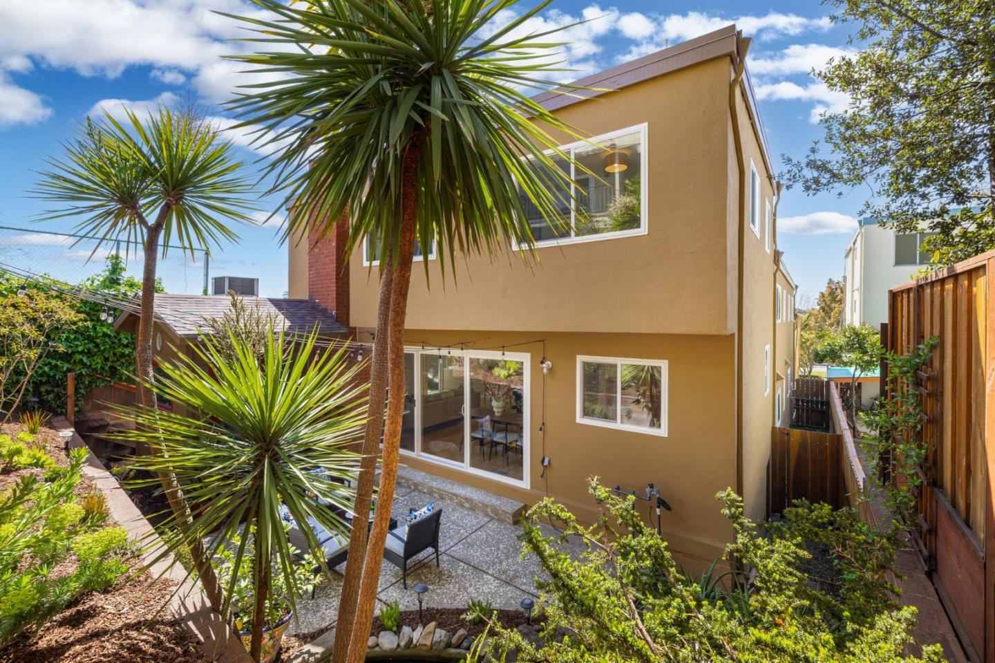 1337 Henry Street, Unit E Berkeley, CA 94709 - Photo 29 of 33 a view of a house with a backyard