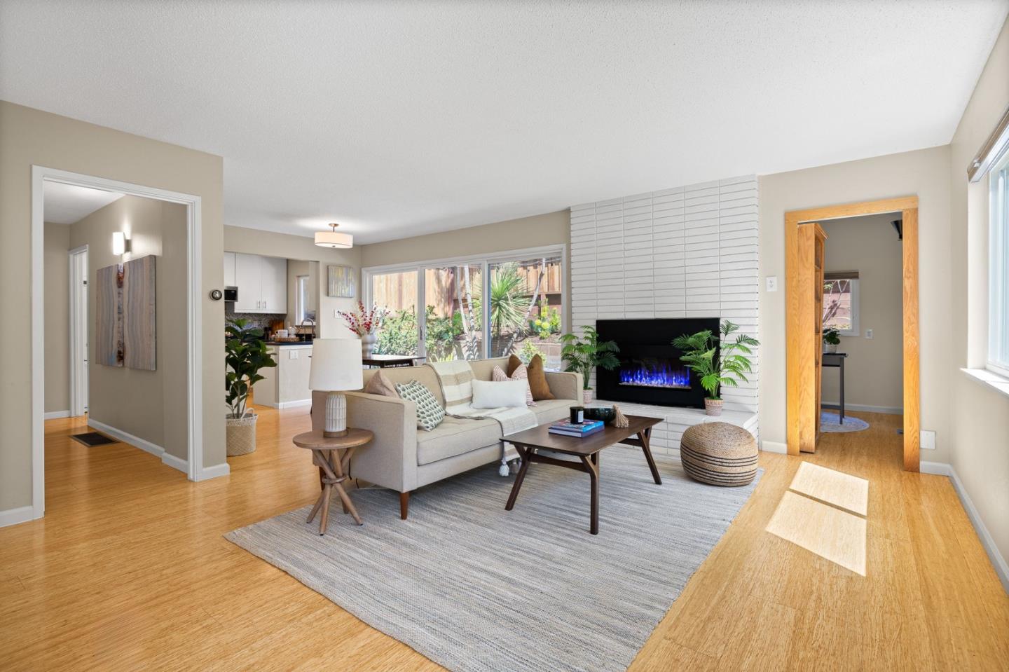 1337 Henry Street, Unit E Berkeley, CA 94709 - Photo 3 of 33 a living room with furniture and a flat screen tv