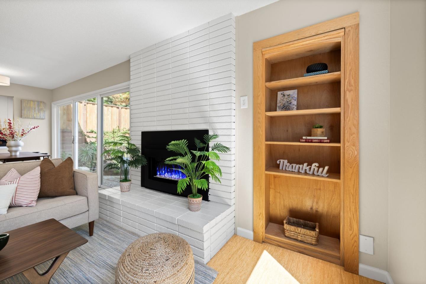 1337 Henry Street, Unit E Berkeley, CA 94709 - Photo 4 of 33 a living room with furniture and a fireplace