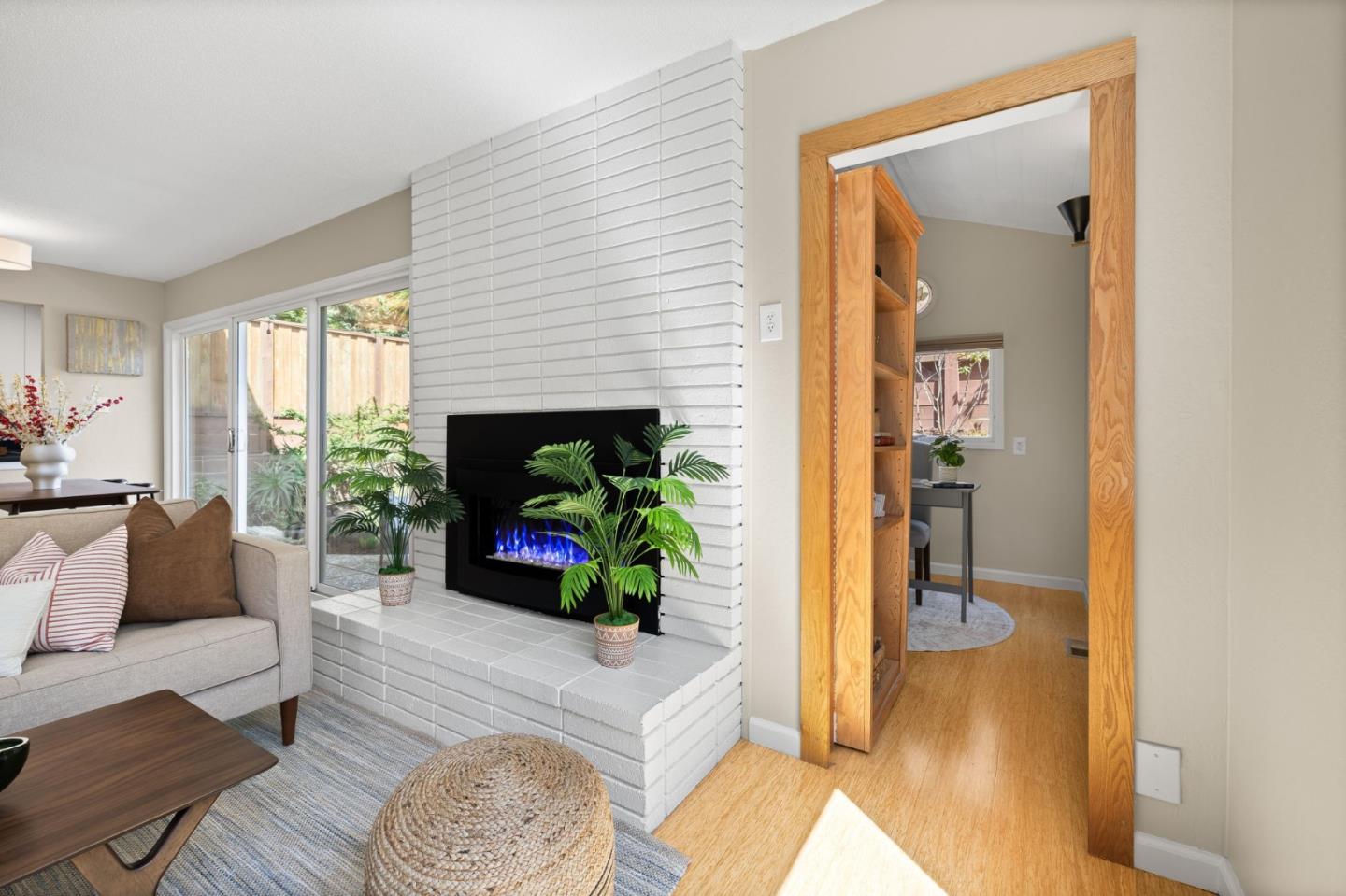 1337 Henry Street, Unit E Berkeley, CA 94709 - Photo 5 of 33 a living room with furniture and a fireplace