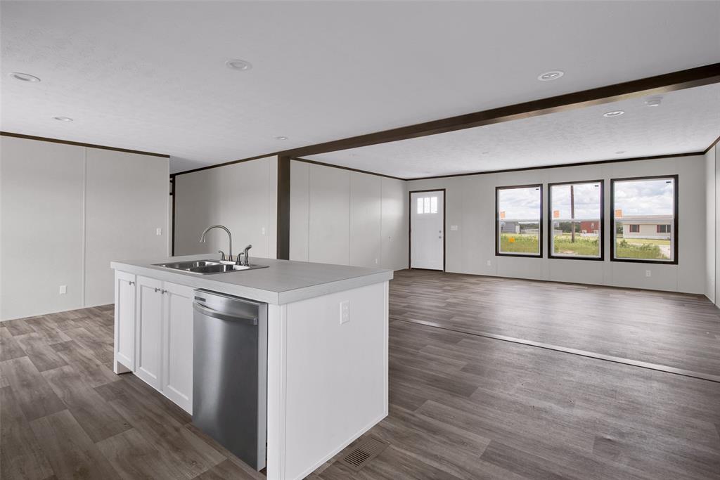 1203 Old Ida Road Sherman, TX 75090 - Photo 11 of 20 a view of an empty room with window and wooden floor