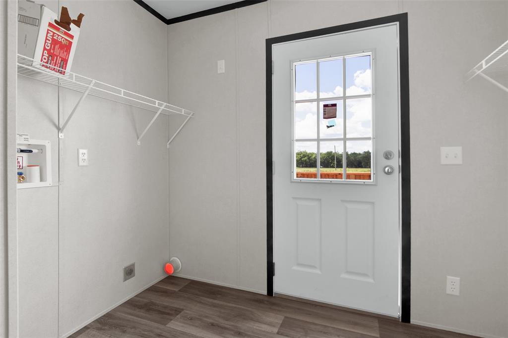 1203 Old Ida Road Sherman, TX 75090 - Photo 15 of 20 a view of an empty room with wooden floor and closet