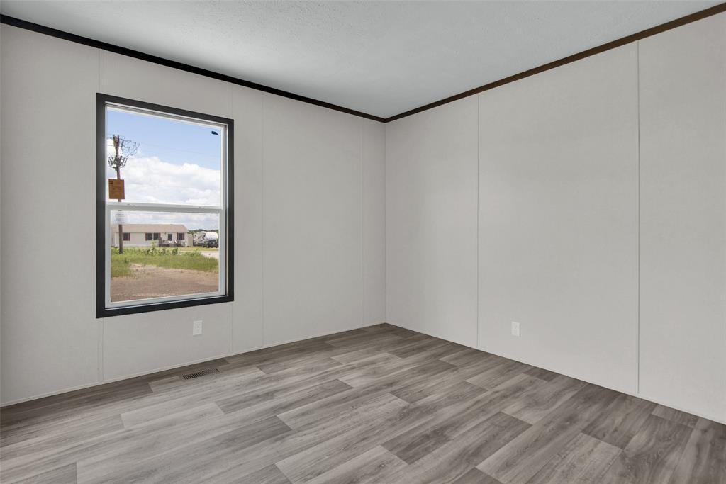 1203 Old Ida Road Sherman, TX 75090 - Photo 19 of 20 a view of a small space with wooden floor and a window