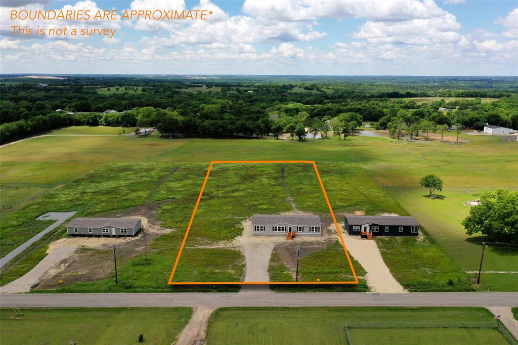 1203 Old Ida Road Sherman, TX 75090 - Photo 3 of 20 a view of a swimming pool with a yard