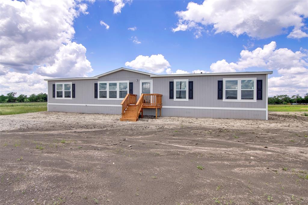 1203 Old Ida Road Sherman, TX 75090 - Photo 6 of 20 a front view of house with yard and trees around