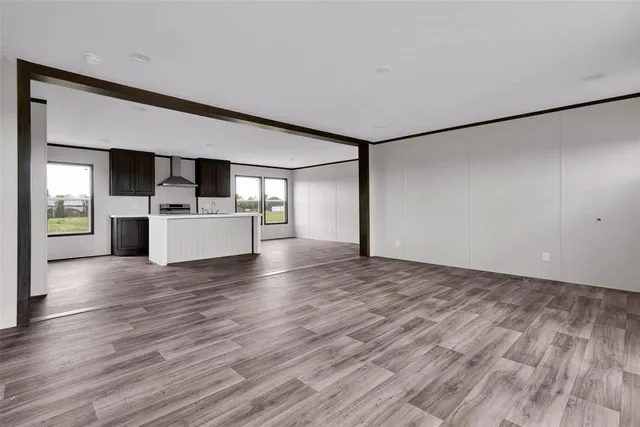 a view of a kitchen with a sink and a refrigerator