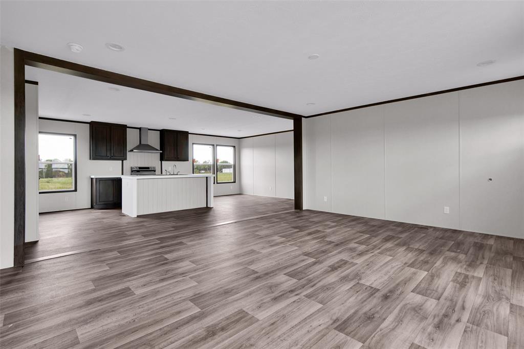 1203 Old Ida Road Sherman, TX 75090 - Photo 8 of 20 a view of a kitchen with a sink and a refrigerator