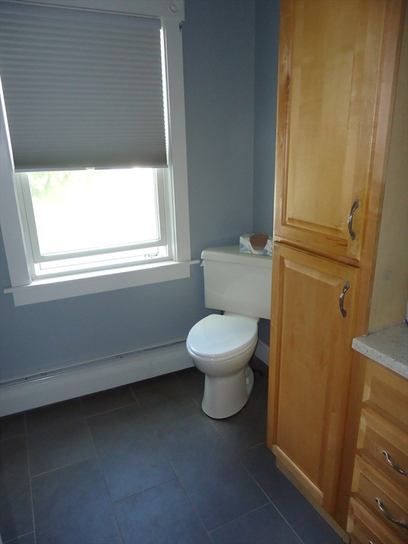 361 River Road Hudson, MA 01749 - Photo 12 of 37 a white toilet sitting next to a window