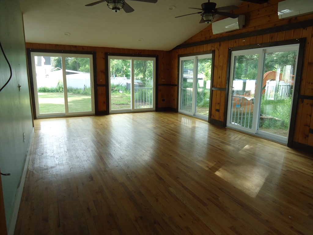 361 River Road Hudson, MA 01749 - Photo 17 of 37 a view of hallway with wooden floor and windows