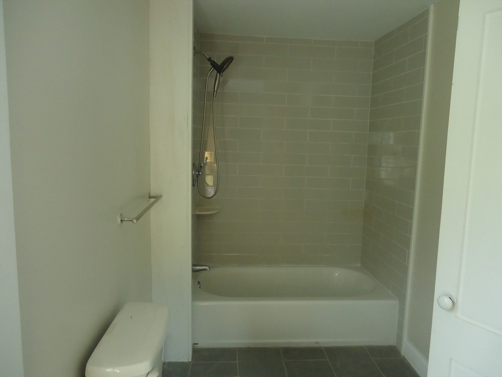361 River Road Hudson, MA 01749 - Photo 25 of 37 a bathroom with a shower and a toilet