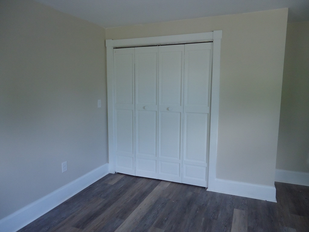 361 River Road Hudson, MA 01749 - Photo 28 of 37 a view of an empty room with wooden floor