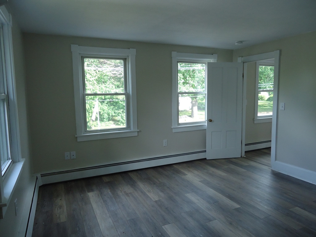 361 River Road Hudson, MA 01749 - Photo 29 of 37 a view of an empty room with wooden floor and a window
