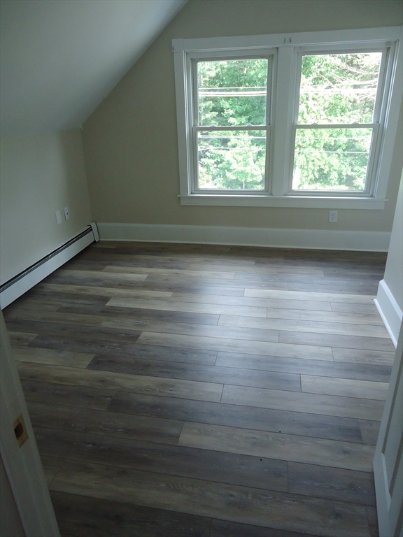 361 River Road Hudson, MA 01749 - Photo 30 of 37 an empty room with wooden floor and windows